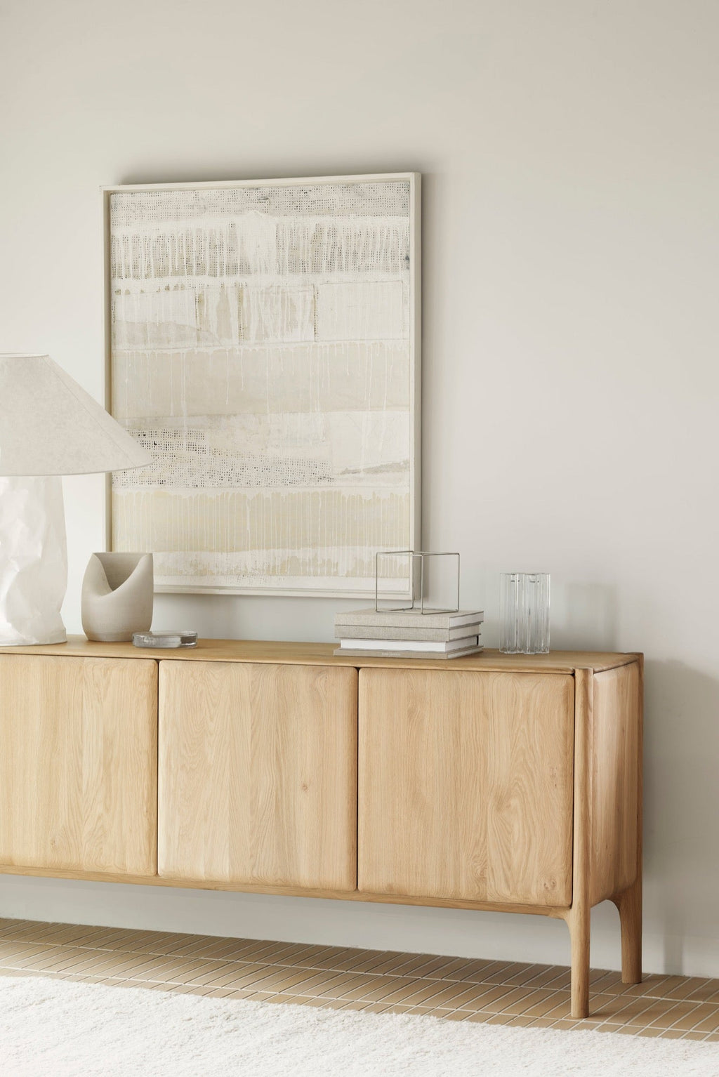 PI Sideboard in white oak with sculpted base and curved edges, modern silhouette and polished finish