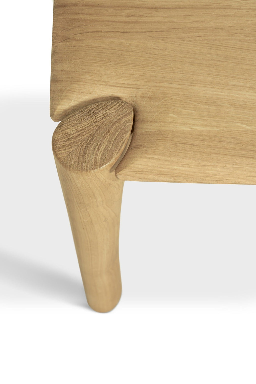 PI Bench in white oak with modern silhouette and sculpted base, polished organic finish, solid wood construction