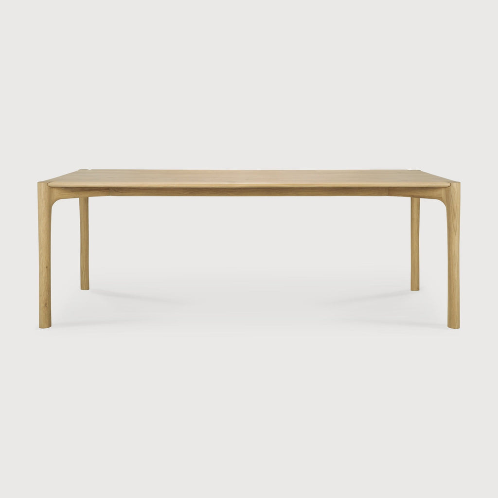PI Dining Table in white oak with sculpted base and curved top edges, modern organic finish