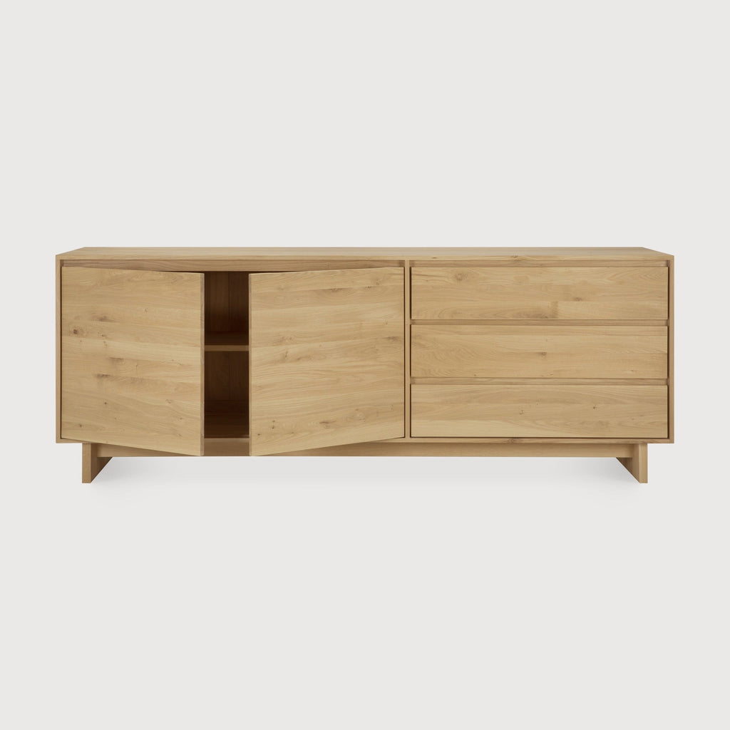 Wave Sideboard in white oak with graceful curved cabinet doors and handle-free drawers