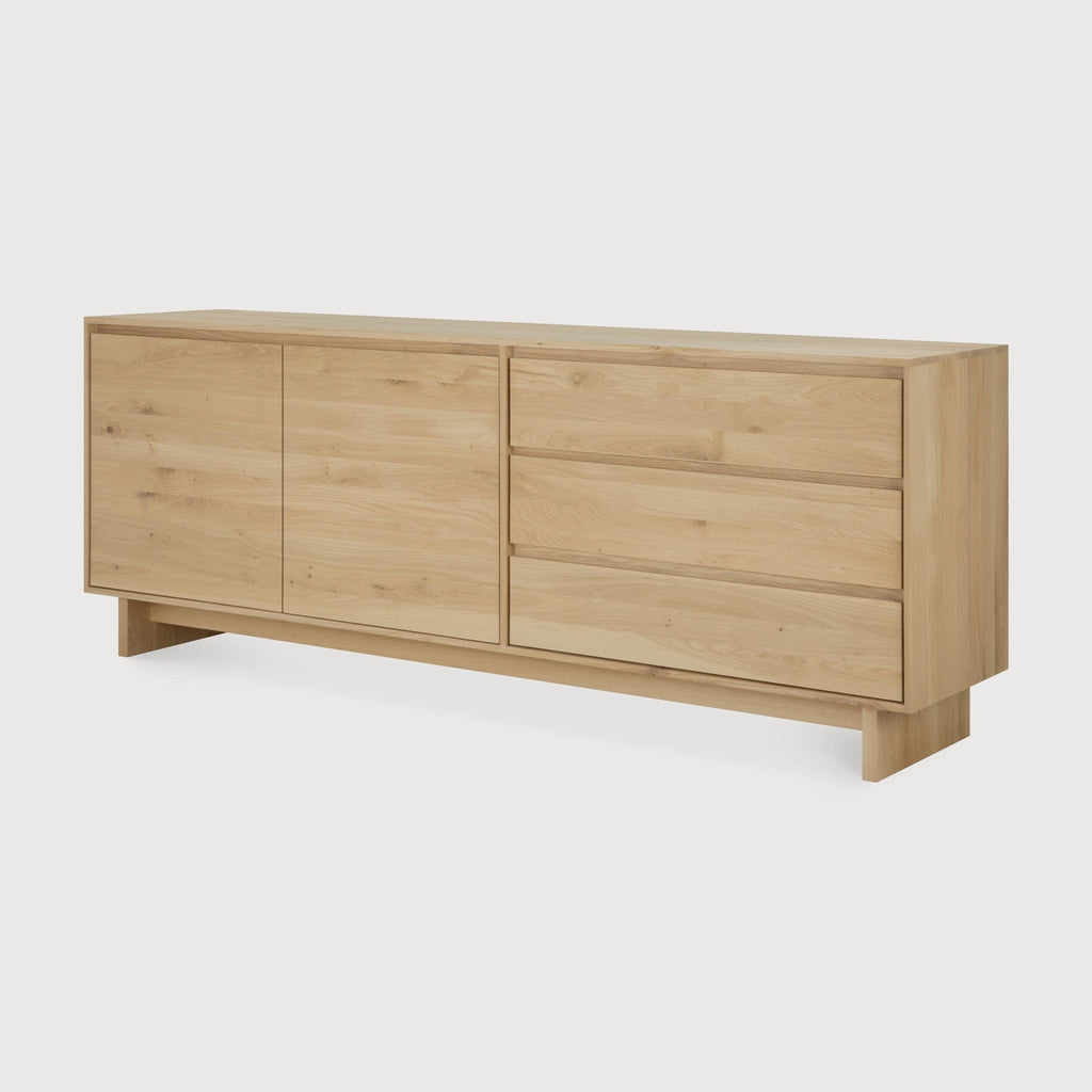 Wave Sideboard in white oak with graceful contours and handle-free doors