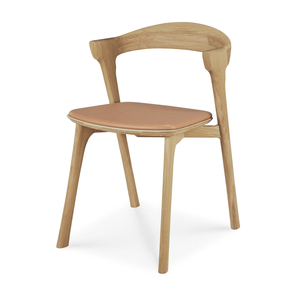 Bok Dining Chair in oak with beige leather upholstery showcasing contoured frame and clean lines