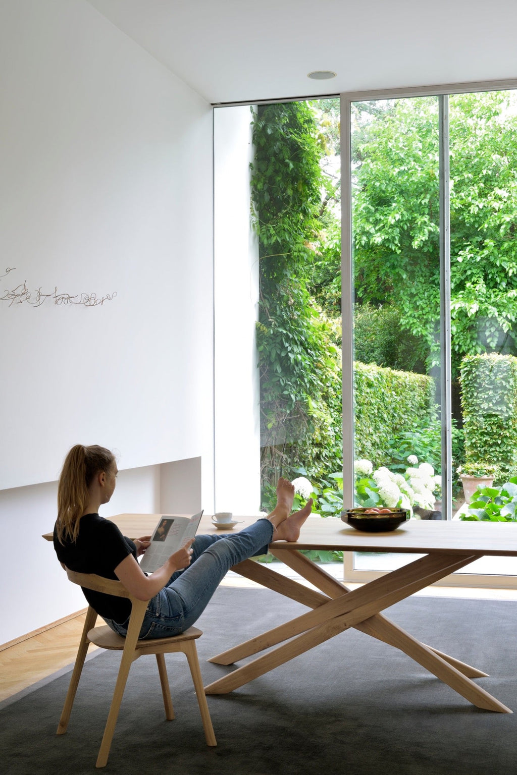 Mikado Dining Table in white oak with sculptural interlocking legs and oiled finish