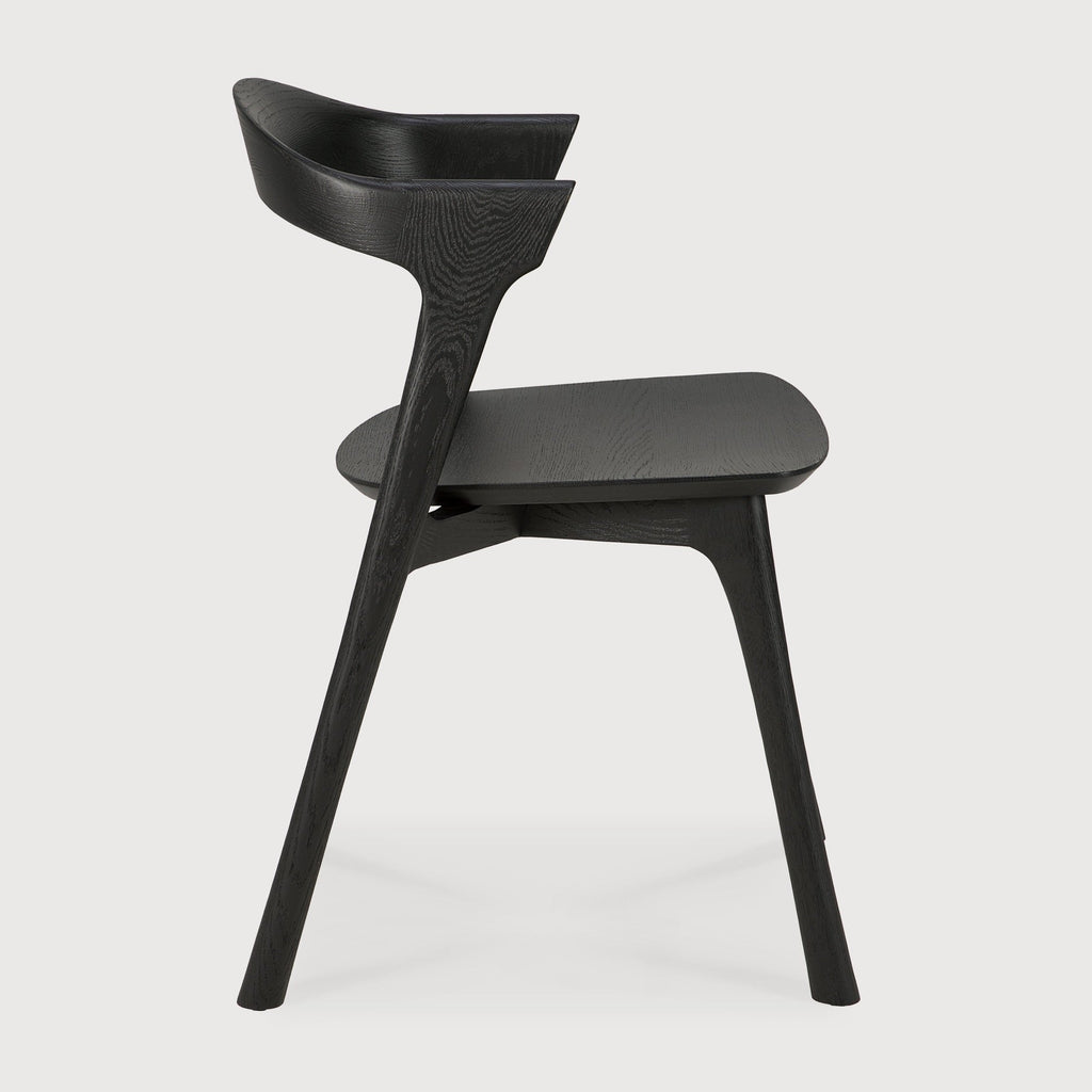 Bok Dining Chair in black oak with contoured frame and sleek design