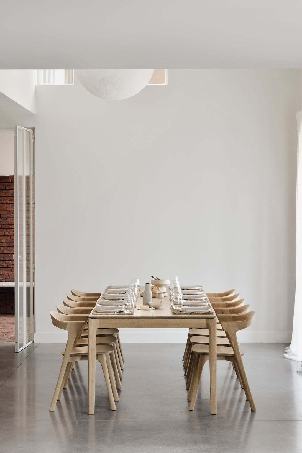 Bok Extendable Dining Table in White Oak with contoured frame and floating top