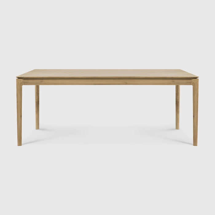 White Oak Bok Dining Table side view with white background, featuring floating table top and beautiful wood joinery. - Saffron and Poe, Ethnicraft