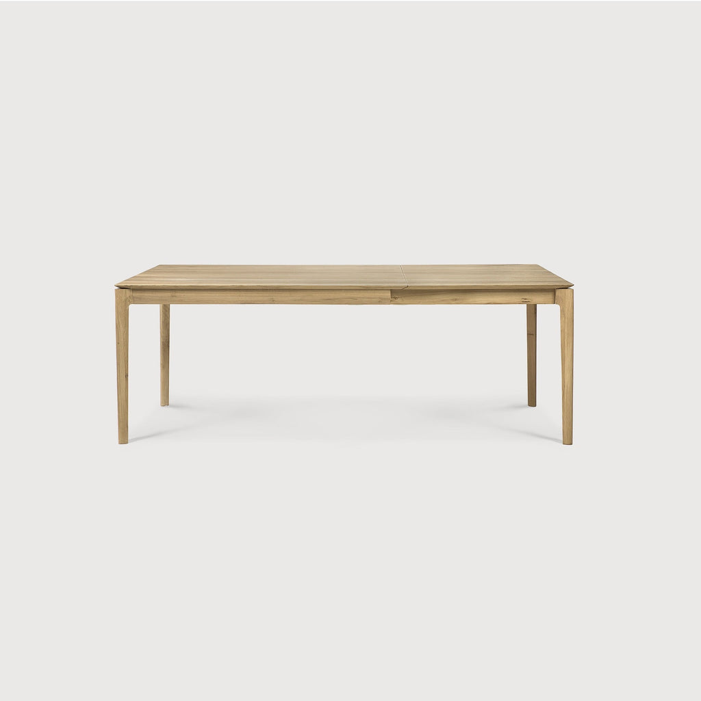 Bok Extendable Dining Table in white oak with contoured frame and floating top