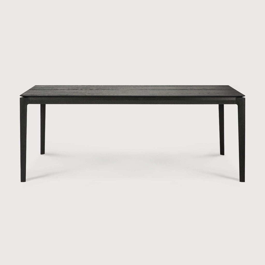 Black oak Bok Dining Table with contoured frame and floating top, solid oak construction