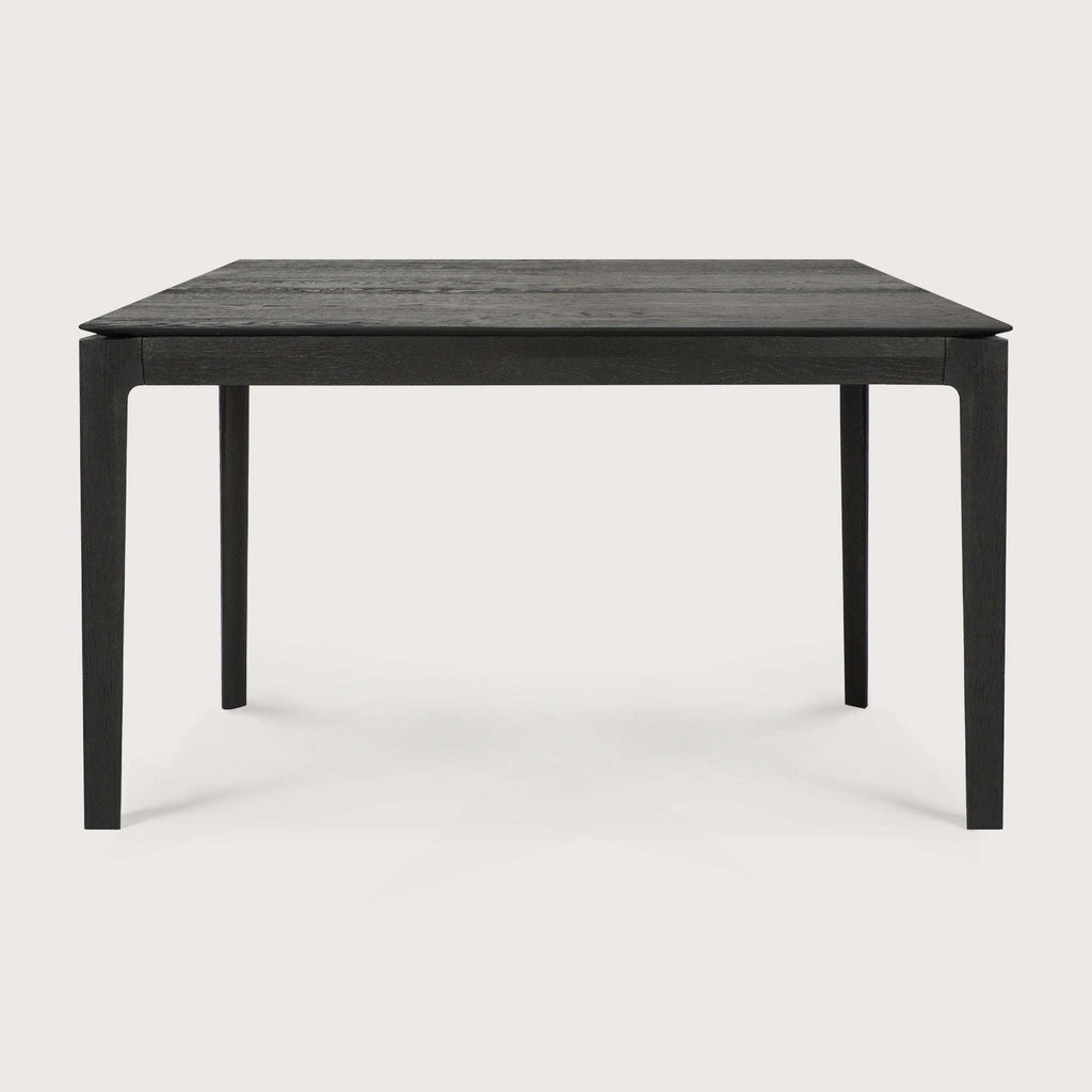 Black oak Bok Dining Table with contoured frame and floating top, solid oak construction
