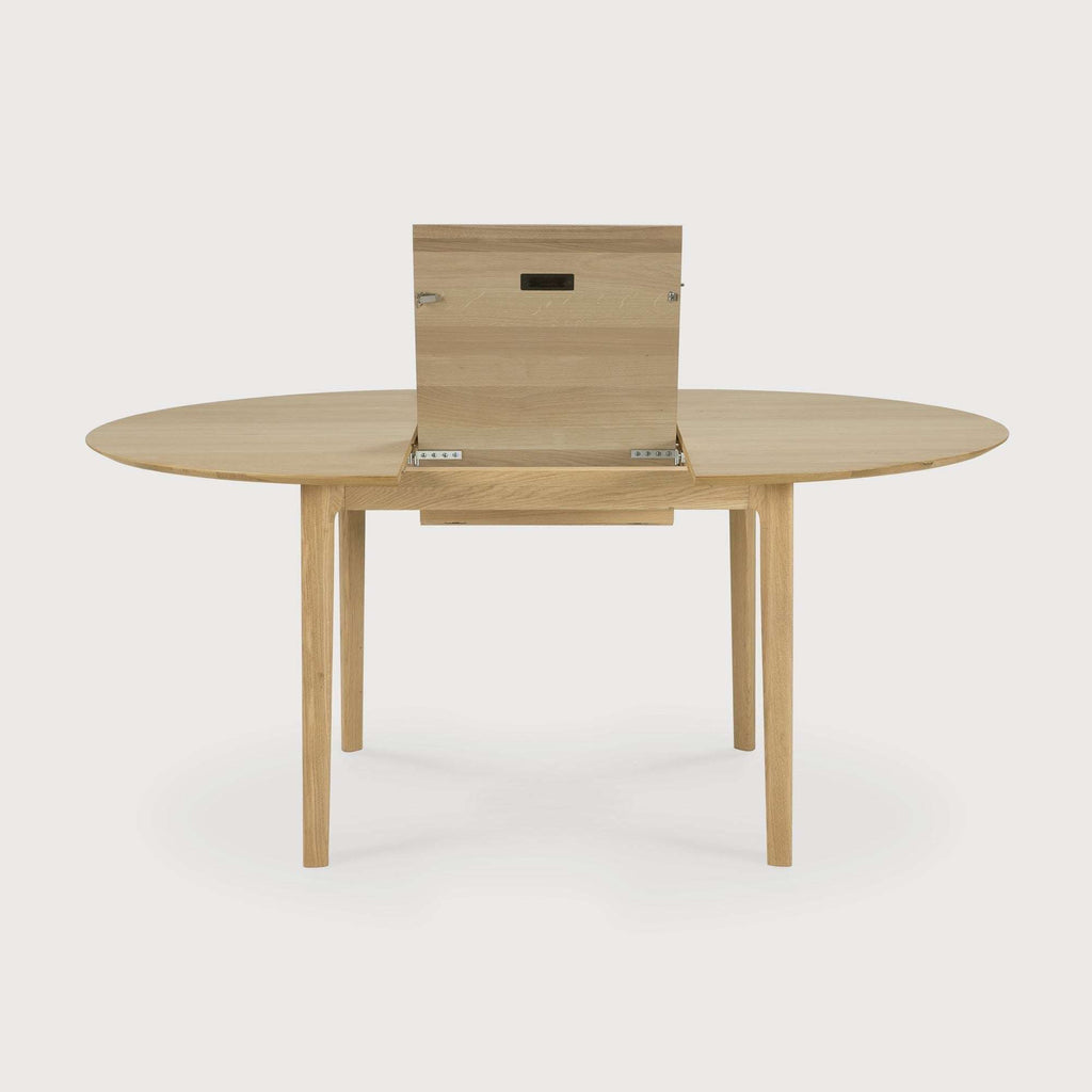 Bok Extendable Round Dining Table in White Oak with oiled finish and sleek design