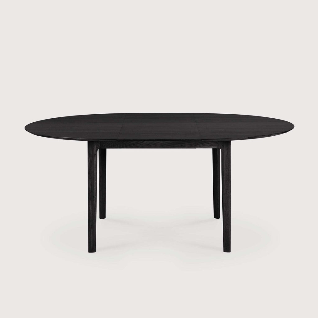 Bok Extendable Round Dining Table in black oak with floating top and contoured frame