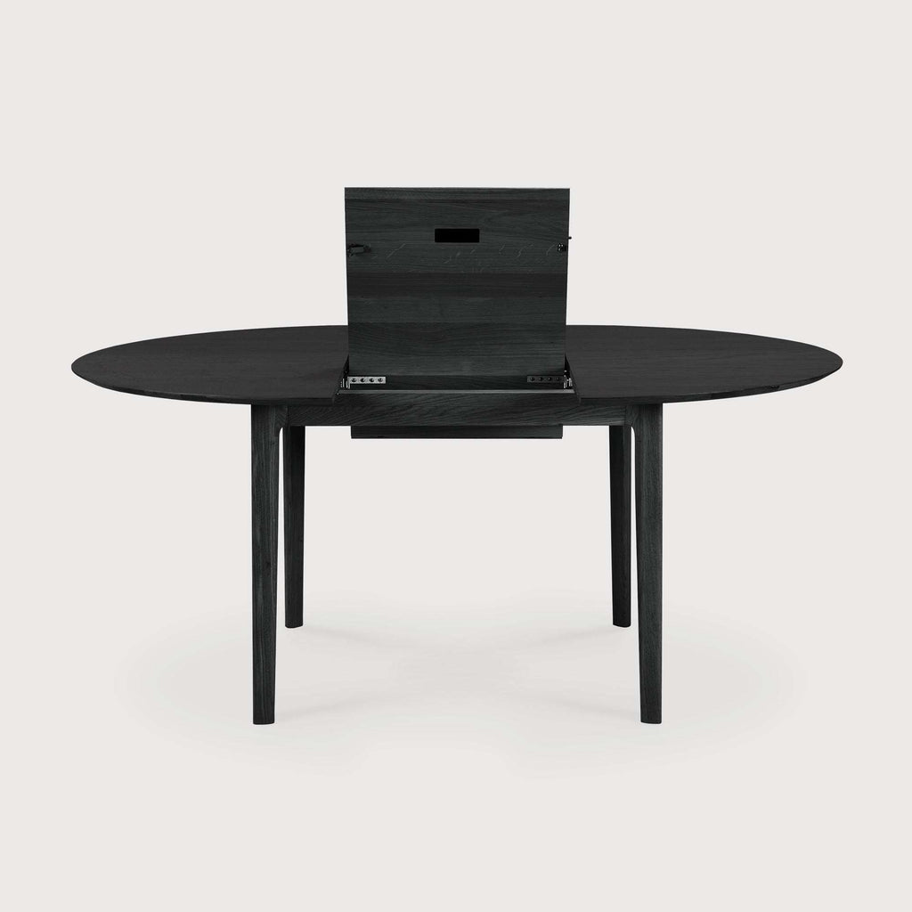 Black oak Bok extendable round dining table with premium solid oak construction and black varnish finish