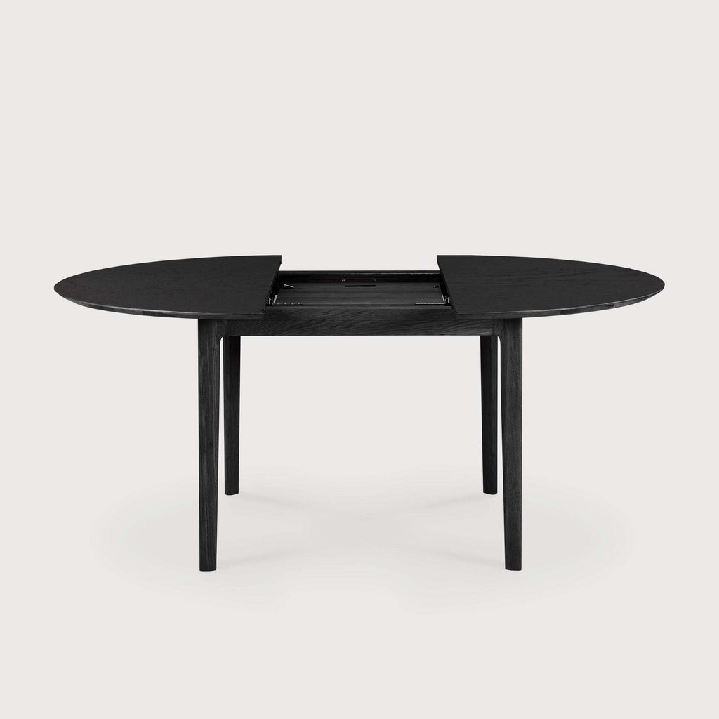 Bok Extendable Round Dining Table in black oak with contoured frame and floating top