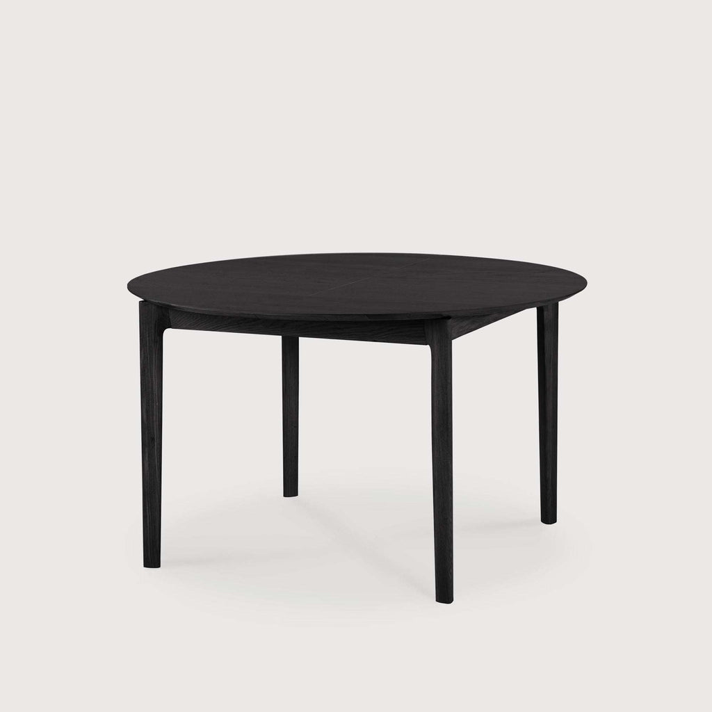 Bok extendable round dining table in black oak with floating top and solid construction