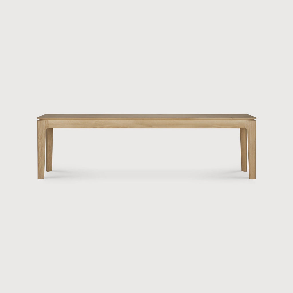 Bok Bench made of solid European White Oak with contoured frame and floating bench top, oiled finish, durable and timeless design