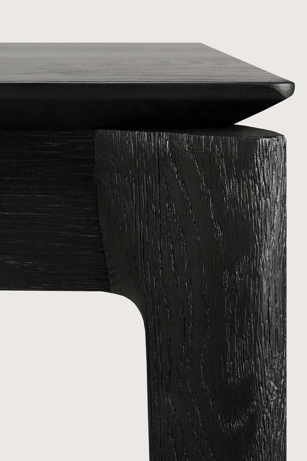 Bok Extendable Dining Table in black oak with contoured frame and floating top