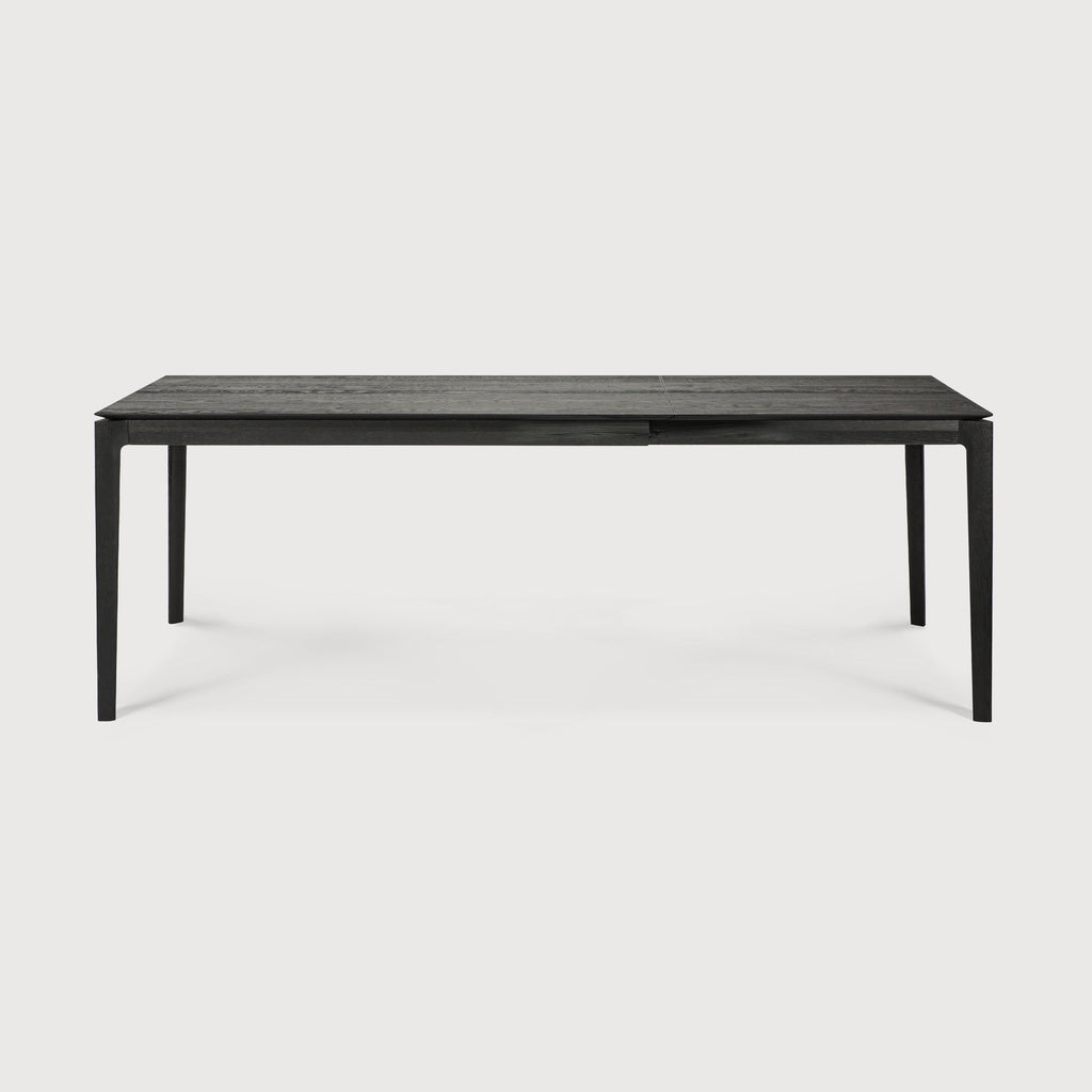 Bok Extendable Dining Table in black oak with floating top and contoured frame