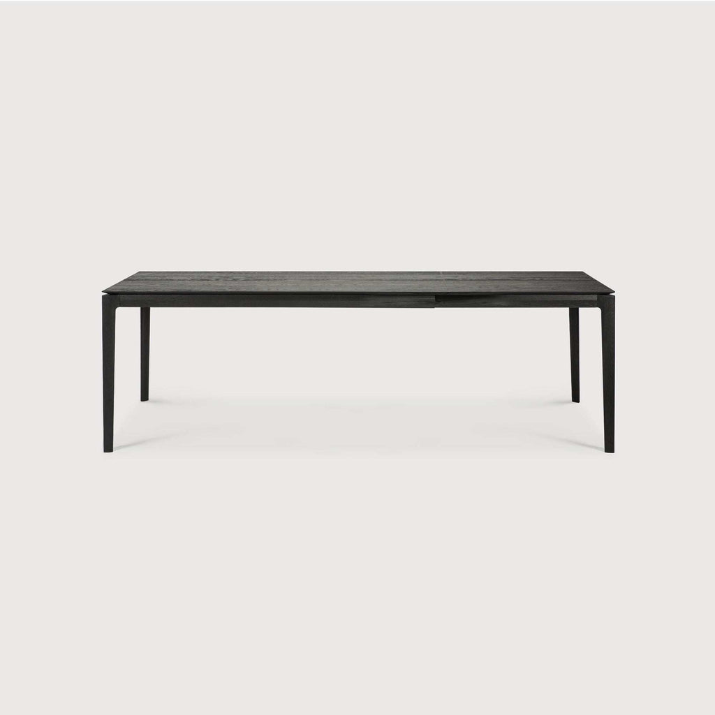 Bok Extendable Dining Table in black oak with floating top and contoured frame