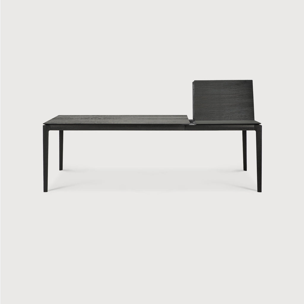 Bok Extendable Dining Table in black oak with floating top and contoured frame