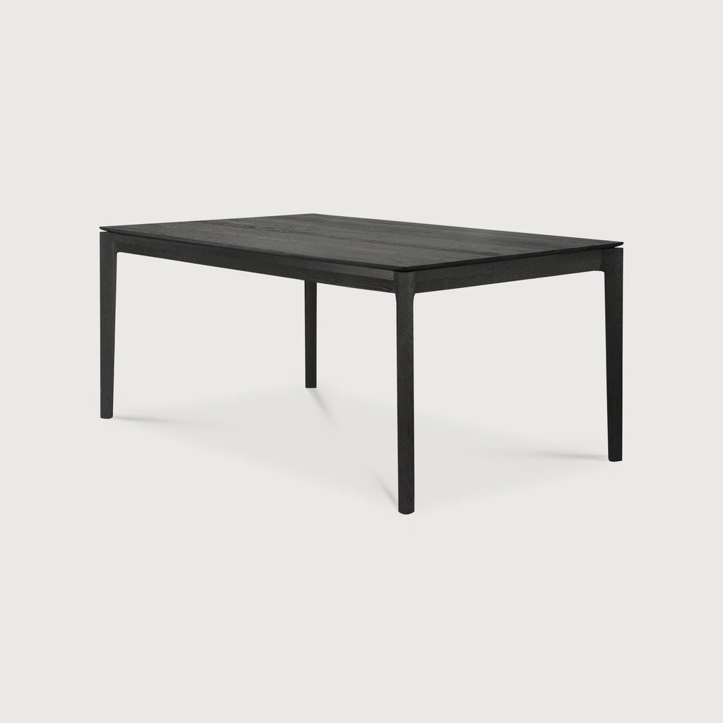 Bok Extendable Dining Table in black oak with floating top and contoured frame
