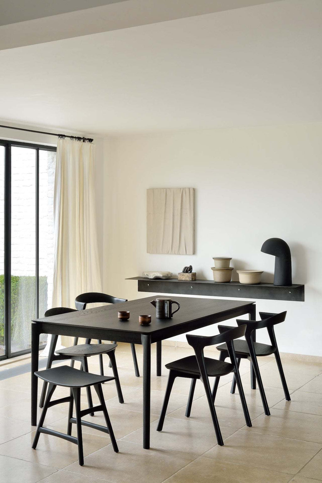 Bok Extendable Dining Table in black oak with floating top and contoured frame