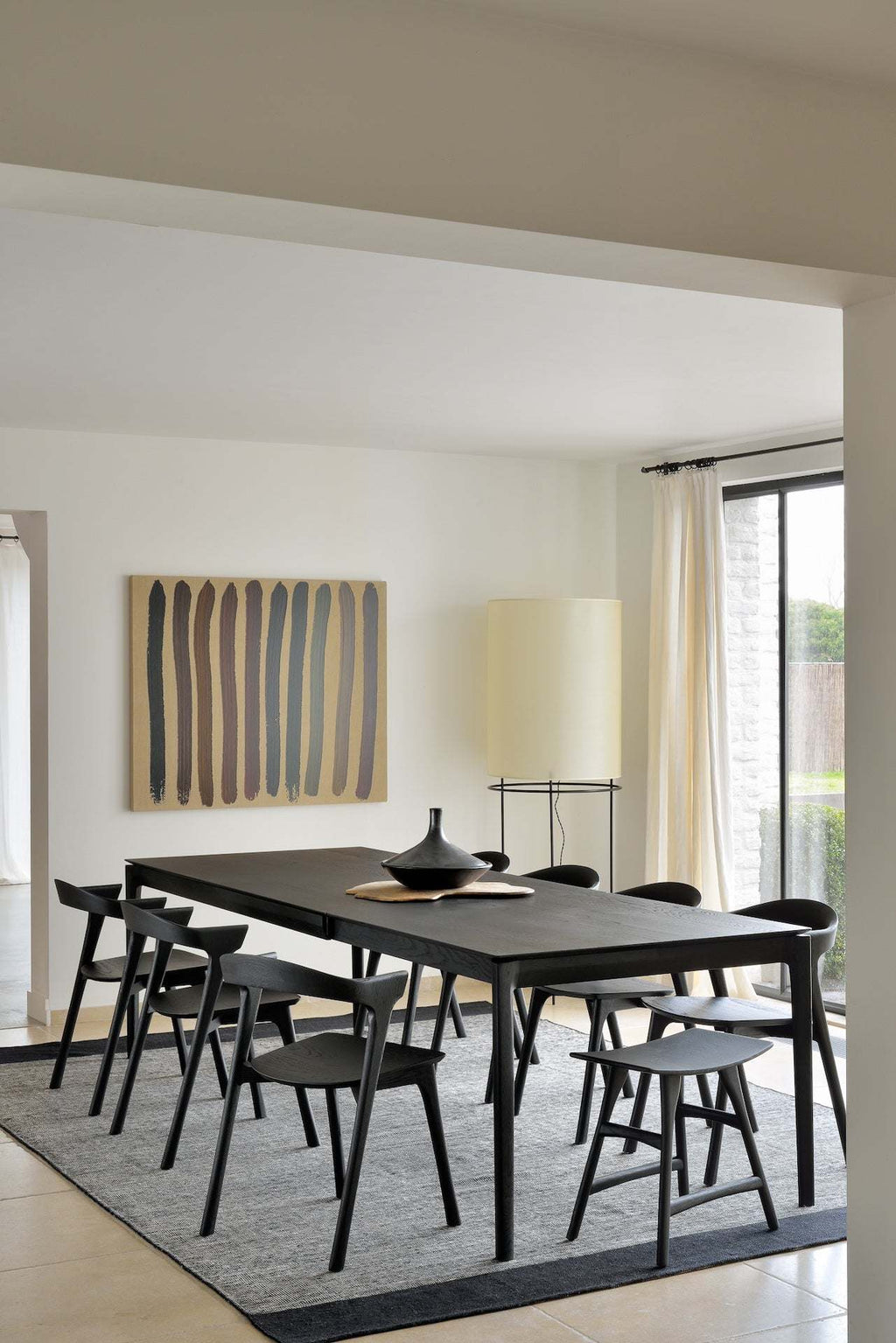 Bok Extendable Dining Table in Black Oak with sleek, sturdy design and floating tabletop