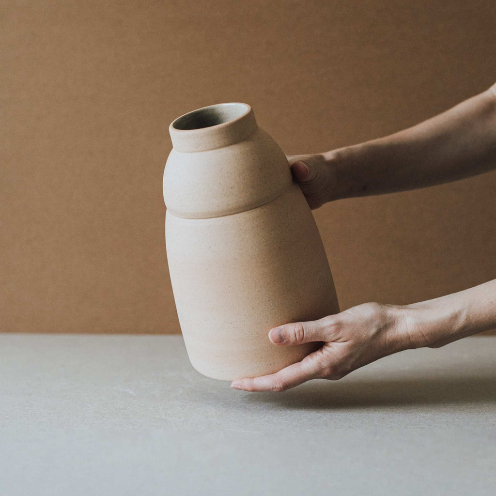 Chubby vase with natural unglazed exterior and unique earthy clay tones