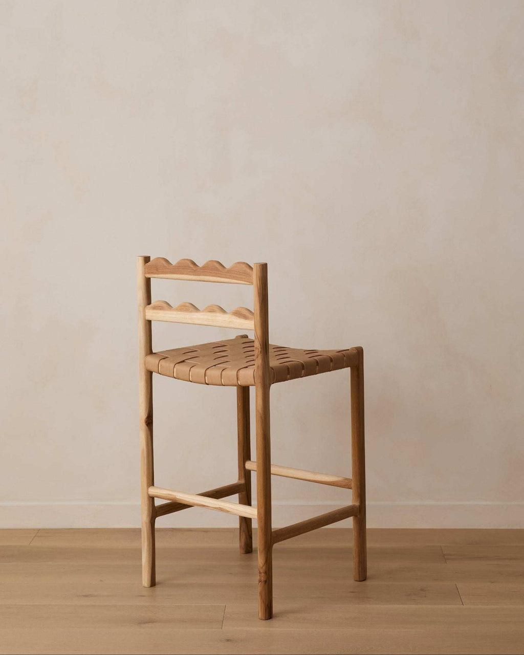 Aegean Scalloped Counter Stool with scalloped teak backrest and woven leather seat