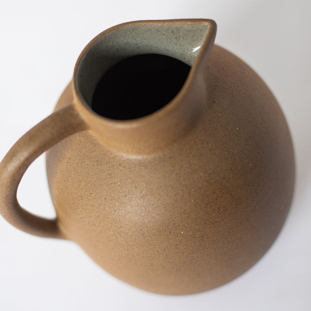 Handcrafted Ball Pitcher ceramic jug with earth tones and glazed interior