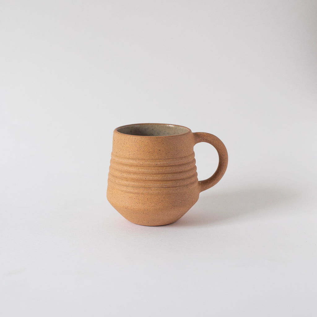 Handcrafted Anillo Mug ceramic cup with natural earth tones and unglazed exterior