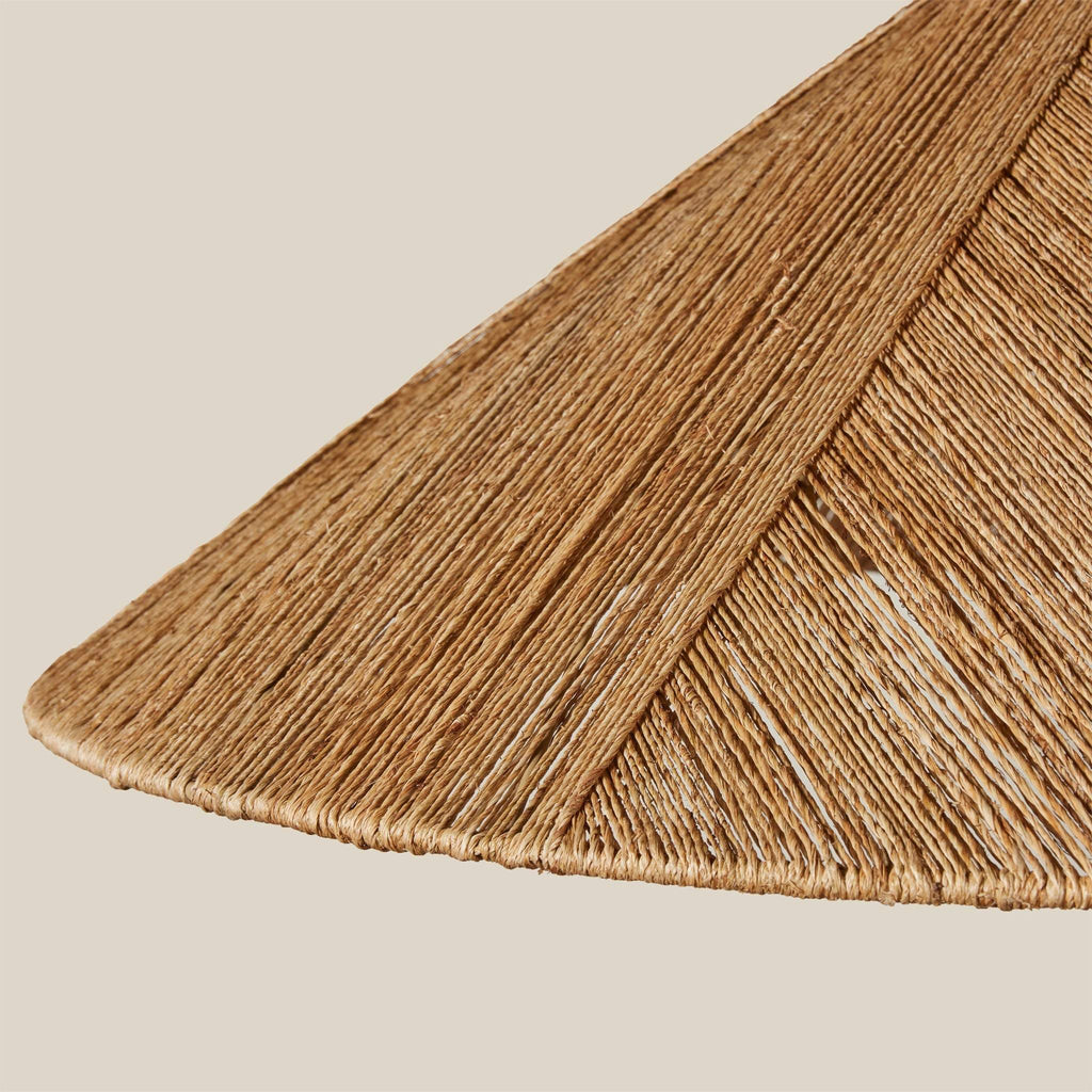 Close-up of an Alhambra Pendant shade with a geometric pattern on a beige background