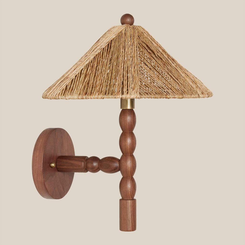 Wooden Alhambra wall sconce with a straw-like lampshade on a beige background