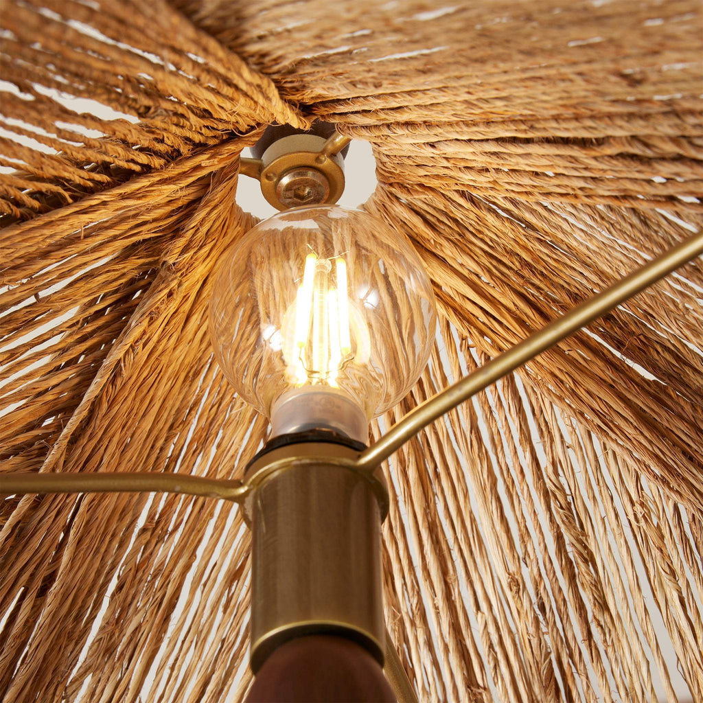 Light bulb with a gold fixture inside Alhambra wall sconce 