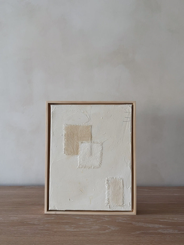 Mini Subdue Art Piece with oak frame on oak table in front of limewashed wall. Saffron + Poe, Art De Avalo