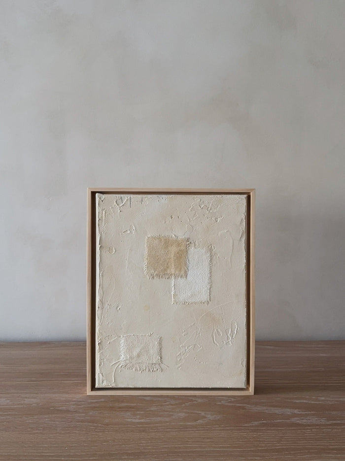 Mini Subdue Art Piece with oak frame on oak table in front of limewashed wall. Saffron + Poe, Art De Avalo