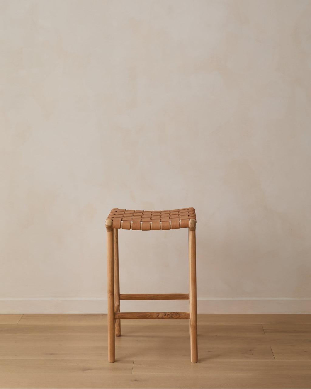 Backless woven leather counter stool in beige with teak frame, handcrafted in Bali, second quality with natural leather and wood variations
