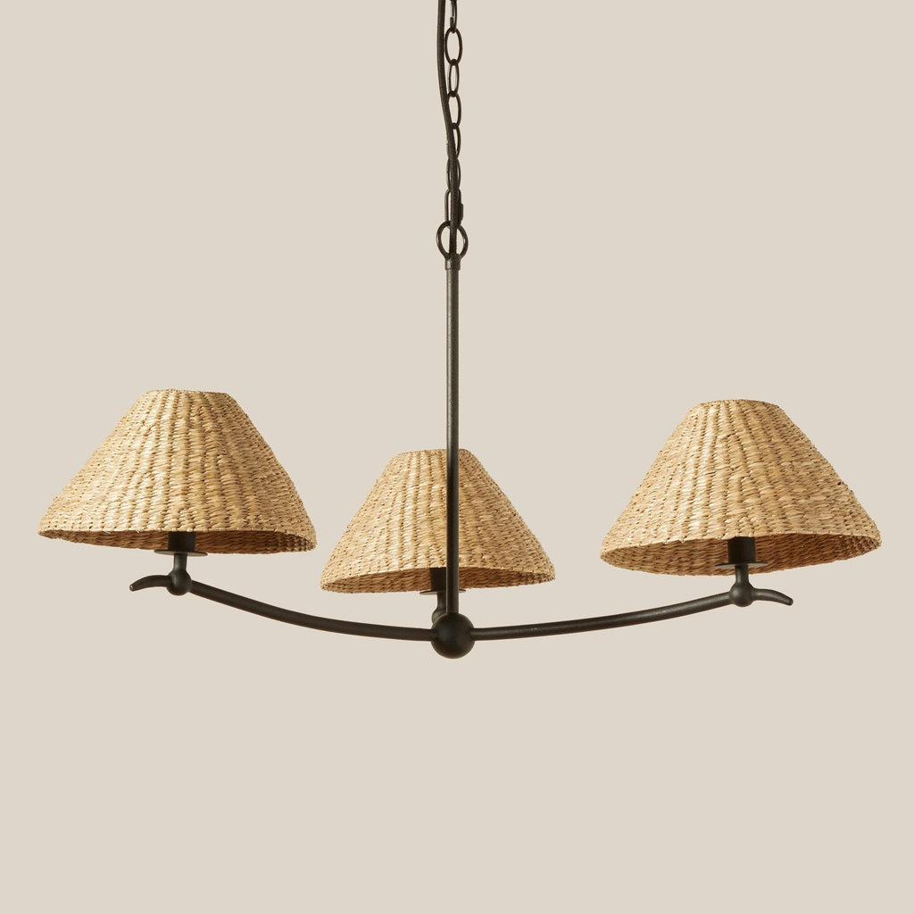 Bainbridge Chandelier with three woven lampshades on a beige background