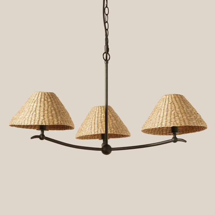 Bainbridge Chandelier with three woven lampshades on a beige background
