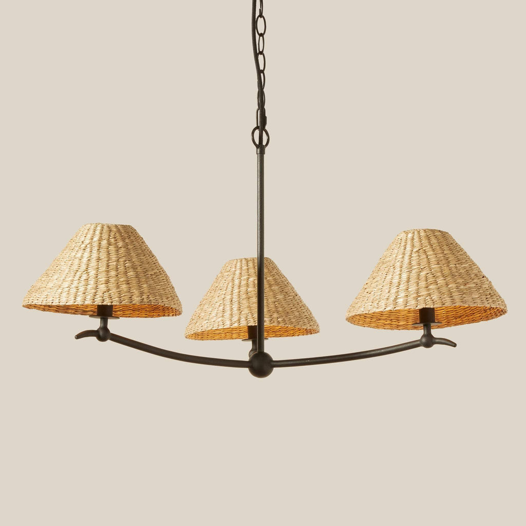Bainbridge Chandelier with three woven lampshades on a beige background