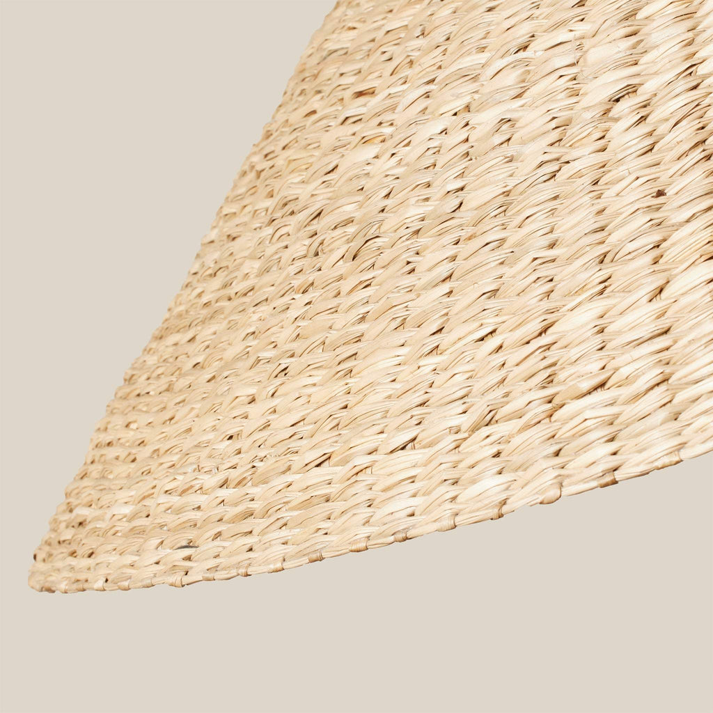 Close-up of a woven shade of Bainbridge Floor lamp with a beige background