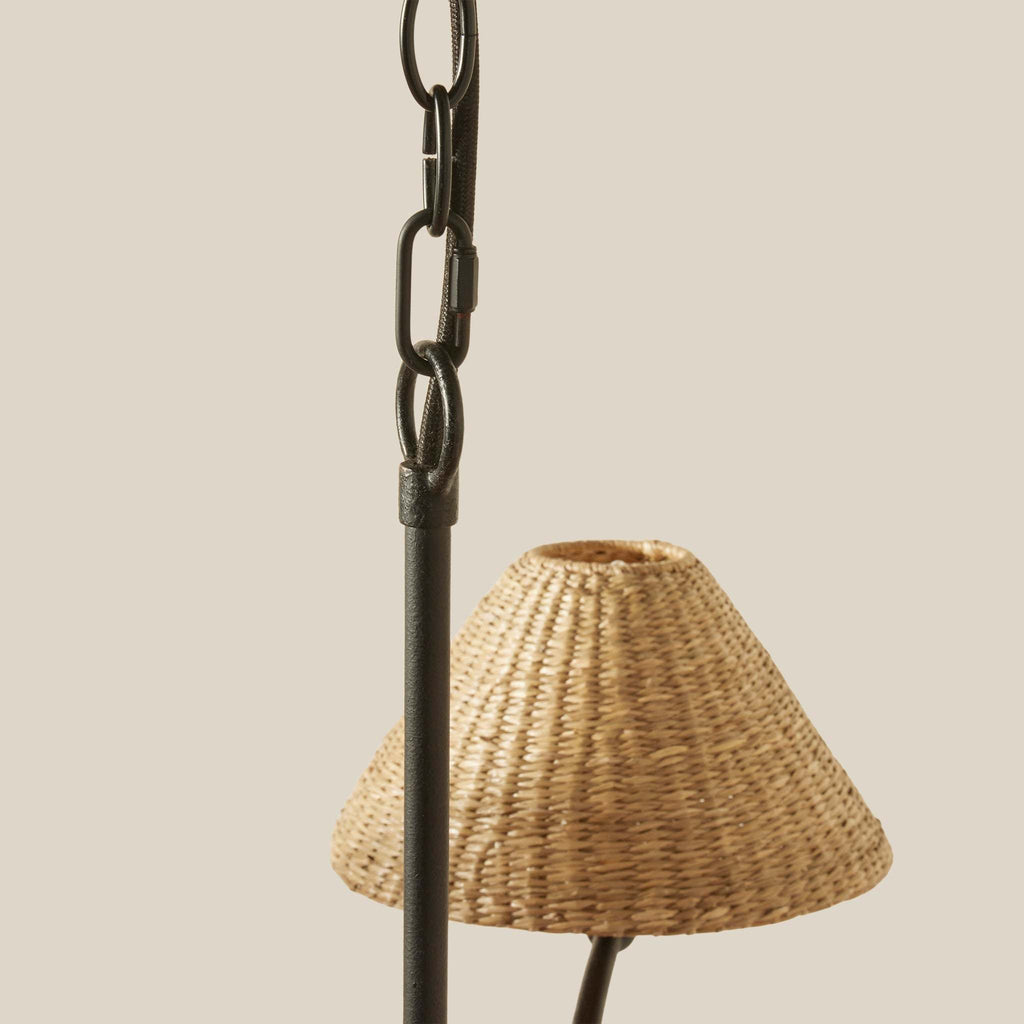 Large Bainbridge chandelier detail with woven shade and black chain on a beige background