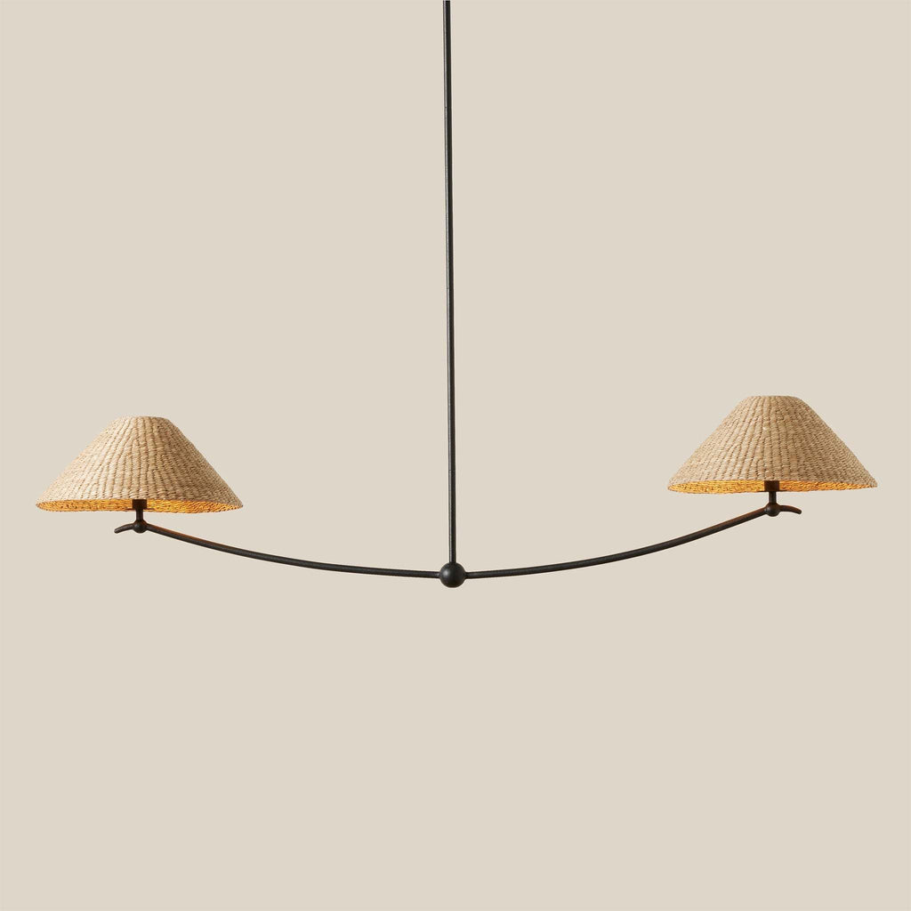Modern Bainbridge Linear Pendant chandelier with wicker lampshades on a neutral background