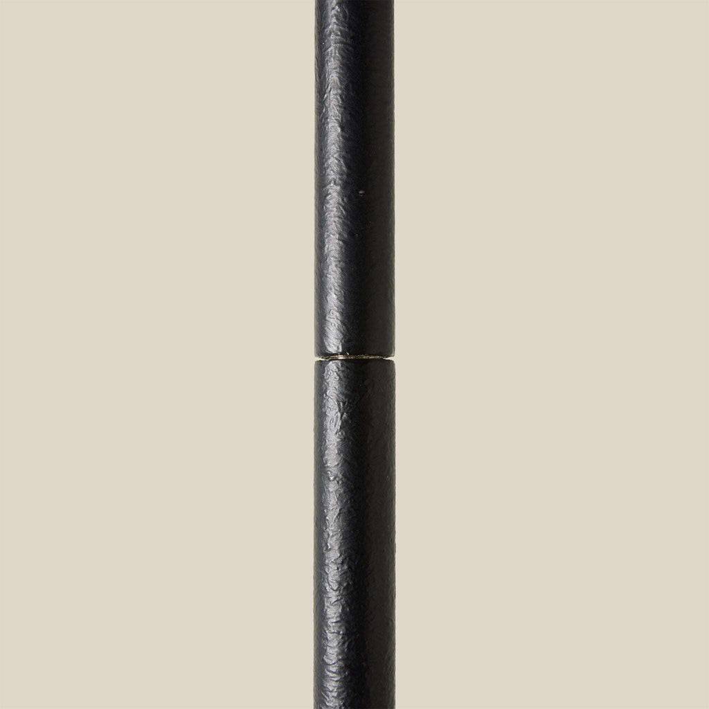 Black Bainbridge pendant stem on a beige background