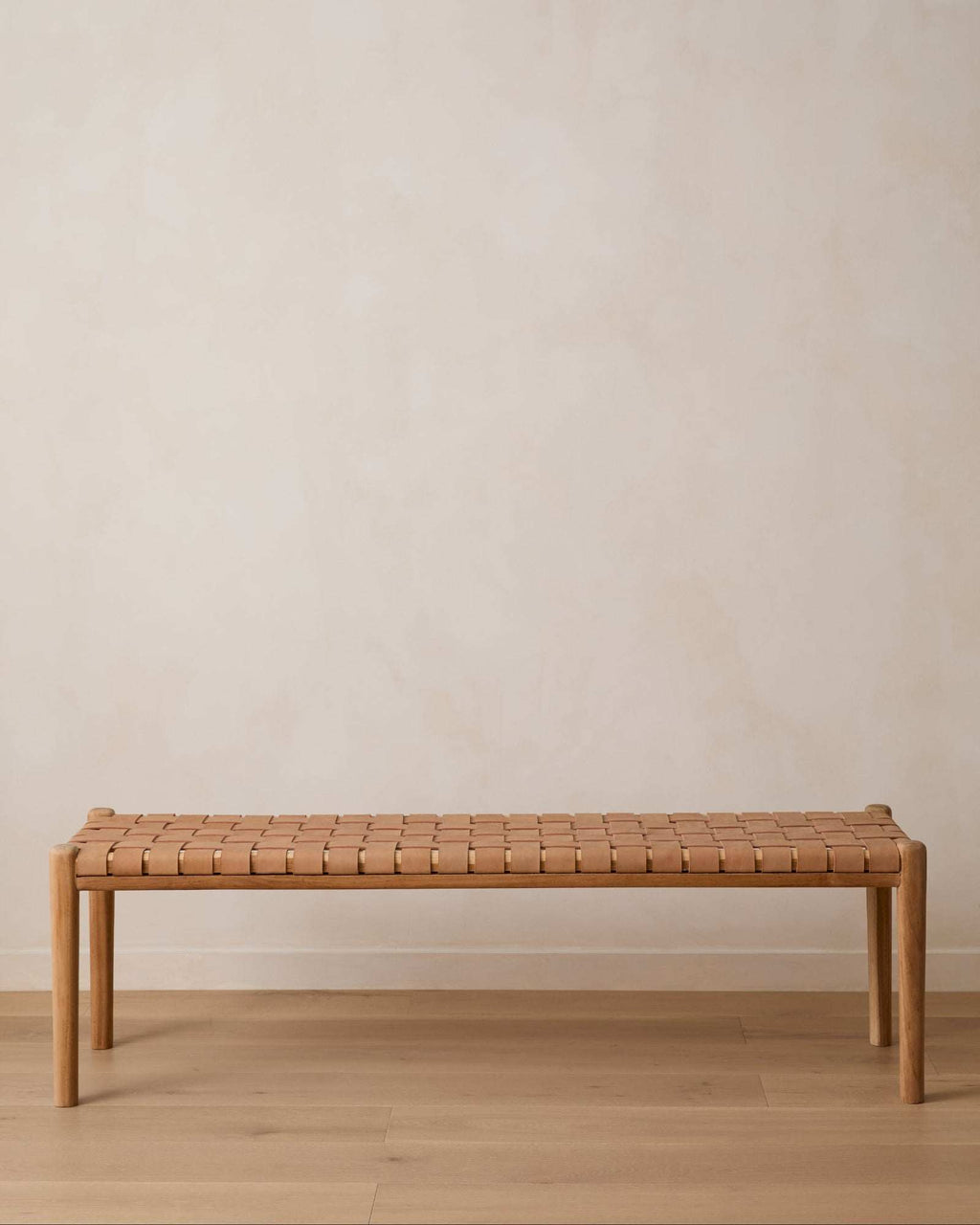 Beige woven leather bench with teak frame and mid-century turned legs