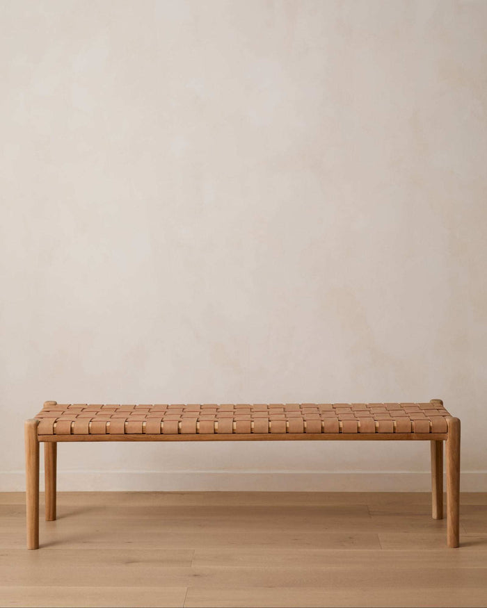 Beige woven leather bench with teak frame and mid-century turned legs