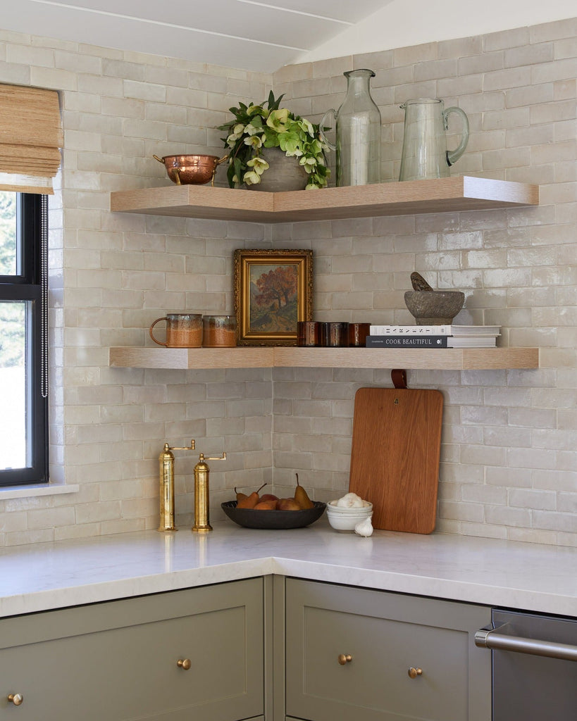 Brass Salt and Pepper Grinders styled on floating shelves in a modern kitchen setting