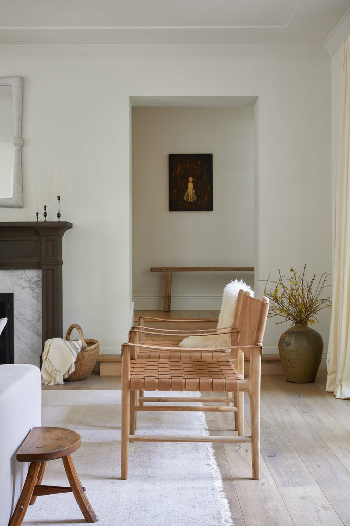 Leather Strap Safari Chair in a living room setting with Antique Chinese Basket. Saffron + Poe