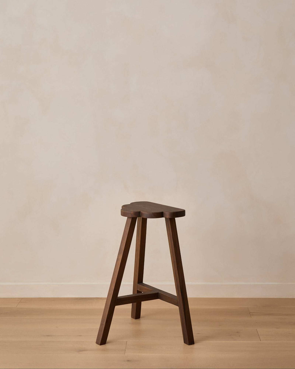 Cloud Counter Stool handcrafted from walnut wood with cloud-shaped seat and modern design