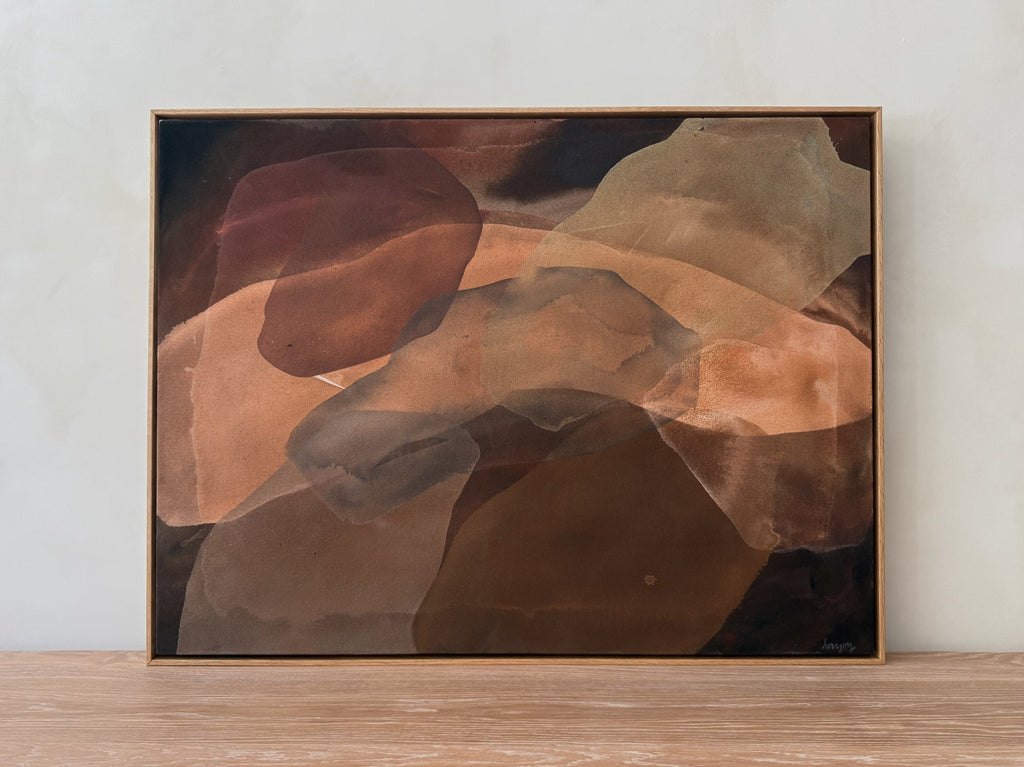 Abstract painting Cocoon with layered sienna, clay, and umber washes evoking earth and shadow on raw canvas in oak frame