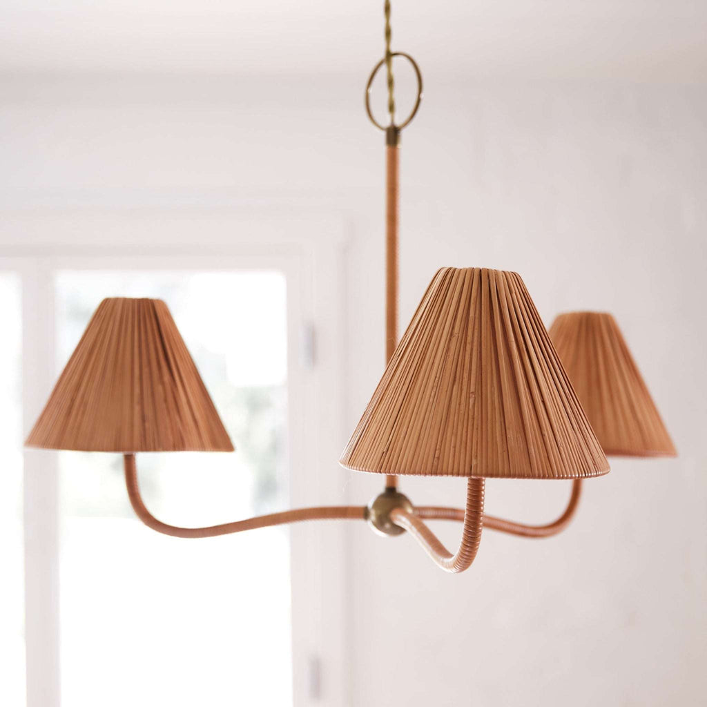 Delphine Chandelier with pleated brown lampshades on a white background